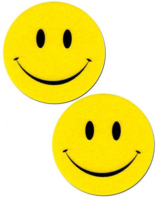 Pair of bright yellow smiley face pasties made from soft felt with black eyes and smiling mouth design.