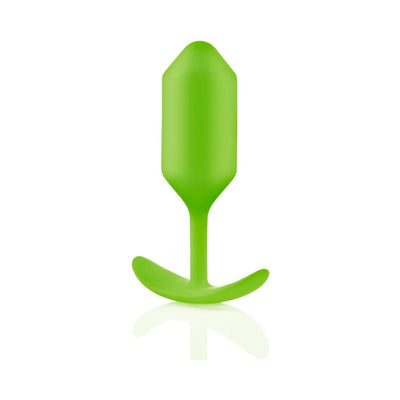 Green seamless silicone weighted plug with flexible neck and curved base for comfortable use.