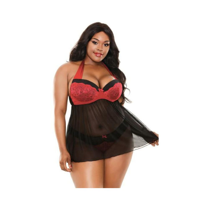 Plus size model wearing black and red halter babydoll with sheer skirt and matching lace-accented panty.