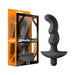 Carbon fiber textured prostate massager with ergonomic curves and bullet vibrator, shown next to its orange and black packaging.