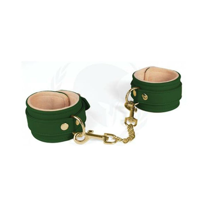 Green Spartacus ankle cuffs with plush beige lining and gold-tone chain and hardware.