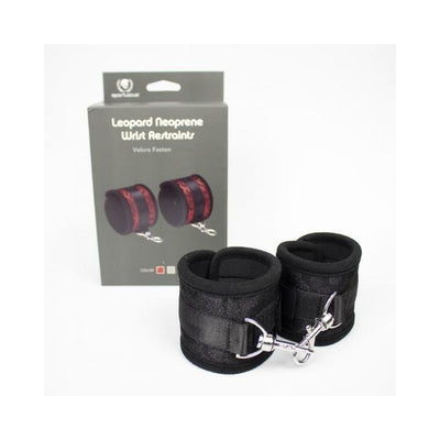 Black neoprene wrist restraints with adjustable Velcro and metal lobster clasp, displayed with packaging box.