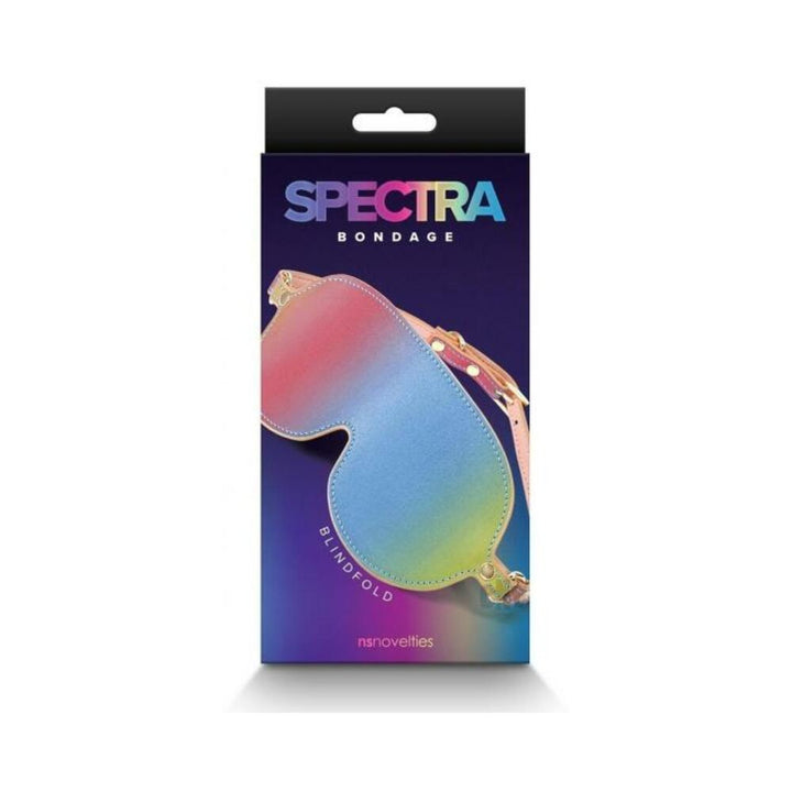 Spectra Bondage blindfold in a rainbow gradient with adjustable straps, displayed in branded packaging.