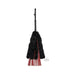 Black faux fur and red faux leather flogger with woven handle and wrist strap hanging on white background