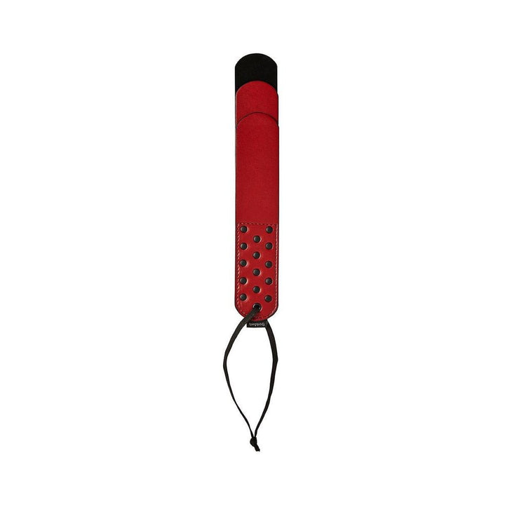 Black and red layered vegan leather paddle with wrist strap and studded handle detail.