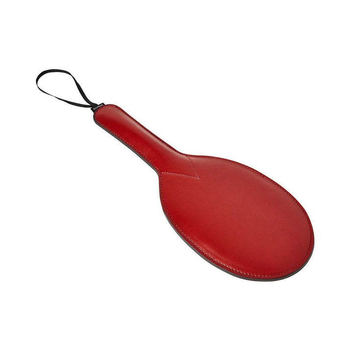 Red vegan leather paddle with wrist loop and stitched edges for precise and comfortable use.