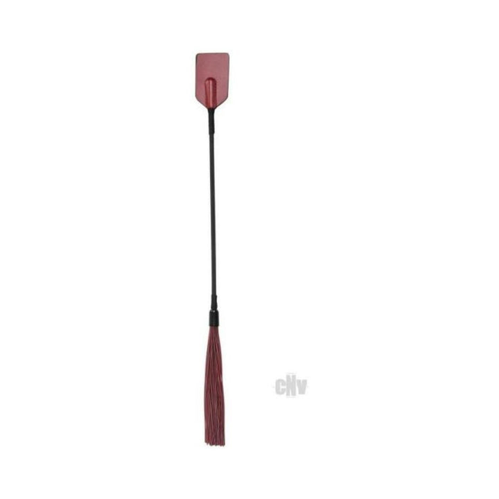 Dual-ended crop and silicone flogger in burgundy and black with a flat paddle on one end and silicone strands on the other.