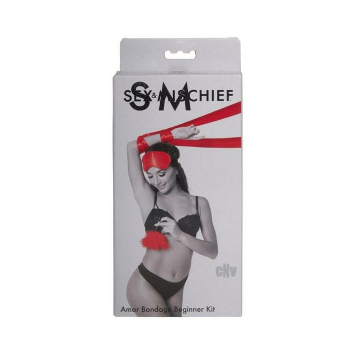 Packaging of Sportsheets Sex & Mischief Amor Bondage Beginner Kit featuring red satin restraints and blindfold with feather accessory.