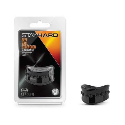 Stay Hard Beef Ball Stretcher 1.5 inch black elastic ring with raised nodules, shown in packaging and separately.
