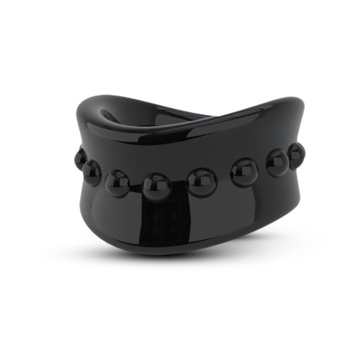 Black glossy scrotum ring with raised bead detailing, designed for comfortable stretching and enhanced sensation.