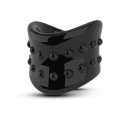 Glossy black scrotum stretcher ring with textured raised nodules for enhanced sensation and comfort.