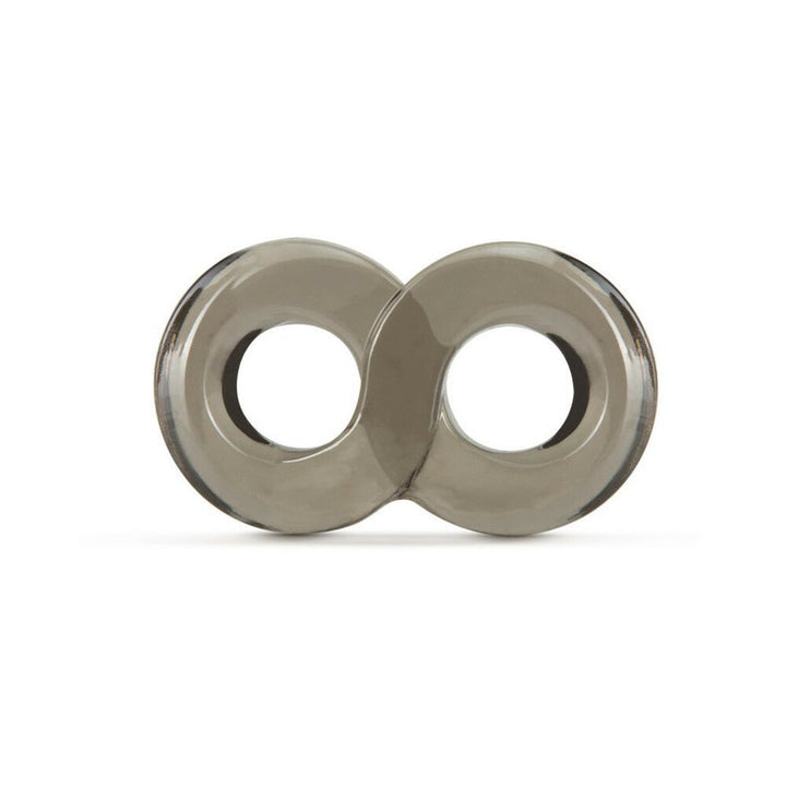 Transparent gray double ring cock and ball strap made of stretchy TPE material on white background.