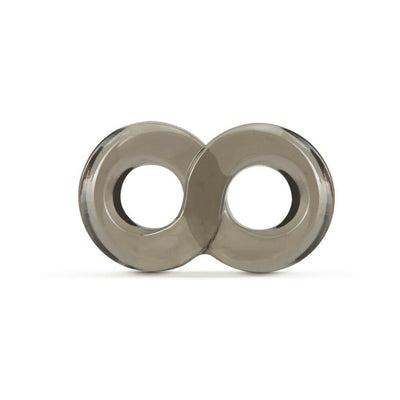 Transparent gray double ring cock and ball strap made of stretchy TPE material on white background.