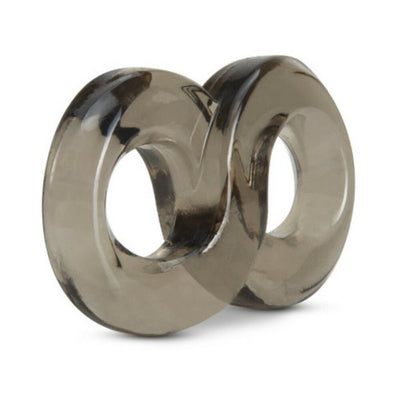 Transparent smoky gray dual ring cock and ball strap made of stretchy TPE material.