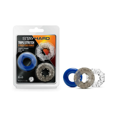 Pack of three Stay Hard Triple Stretch cock rings in blue, gray, and clear, shown in and out of packaging.