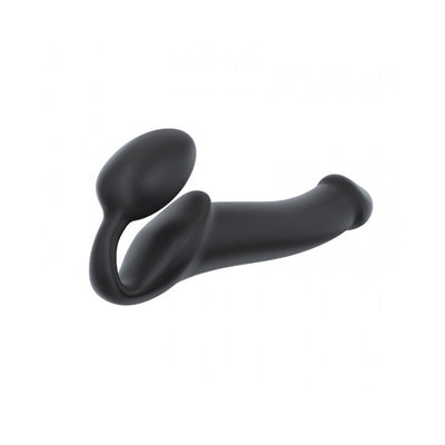 Black bendable strapless strap-on with ergonomic design and dual stimulation features made of soft-touch silicone.