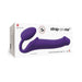Purple silicone bendable strap-on displayed on white packaging box with strap-on-me branding and size L label.