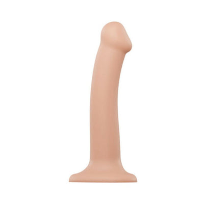 Medium-sized bendable silicone dildo with suction base in natural skin tone color.