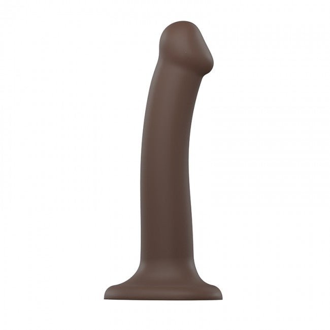 Medium-sized bendable silicone dildo in dark brown with suction base for hands-free use.