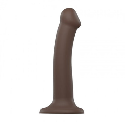 Medium-sized bendable silicone dildo in dark brown with suction base for hands-free use.