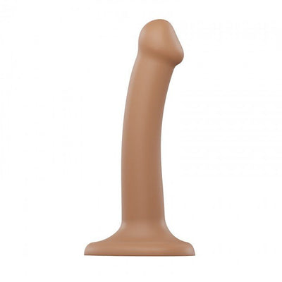 Small dual density bendable silicone dildo with suction cup base in natural skin tone.
