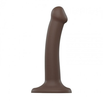 Small bendable dual density silicone dildo in dark brown with suction cup base for hands-free use.