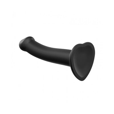 Small black bendable silicone dildo with heart-shaped suction cup base for hands-free use.