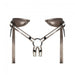 Adjustable brown leatherette strap-on harness with padded back straps and central O-ring for dildo attachment.