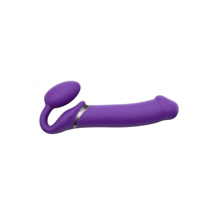 Purple silicone strap-on with curved design and dual stimulation features, including a flexible clitoral arm and smooth shaft.