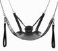 Black leather bondage sling with padded pillow, adjustable straps, and detachable stirrups suspended by metal chains.