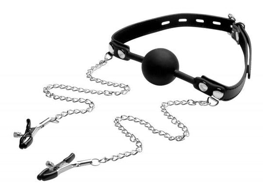 Black silicone ball gag with adjustable PU leather strap and attached metal nipple clamps on chains.