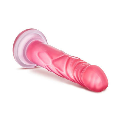 Pink realistic dildo with suction cup base, textured for a lifelike experience, designed for versatile use.