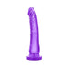 Purple realistic dildo with slight curve and suction cup base standing upright on white background