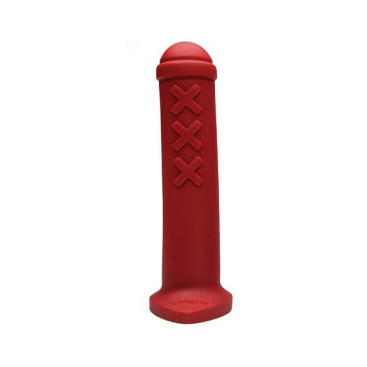 Red silicone mini toy inspired by Amsterdam traffic barriers with three raised X marks and a rounded top.