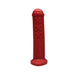 Red silicone mini toy inspired by Amsterdam traffic barriers with three raised X marks and a rounded top.
