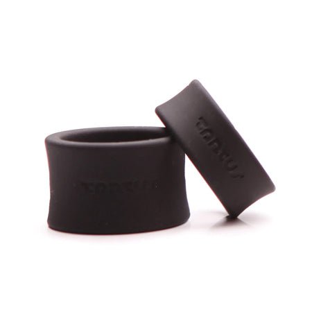 Two black silicone ball stretchers in different sizes with Tantus branding on a white background.