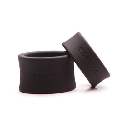 Two black silicone ball stretchers in different sizes with Tantus branding on a white background.