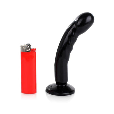 Black compact curved silicone dildo with suction base next to a red lighter for size comparison.