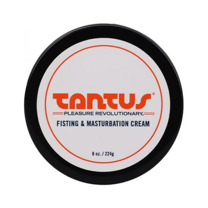 Top view of Tantus Fisting & Masturbation Cream container with black lid and white label in orange and black text.