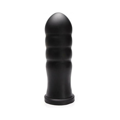 Black silicone textured adult toy with a rounded tip and ribbed design, standing upright on a flat base.