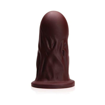 Dark brown firm silicone dildo with textured surface and wide base, standing upright on a white background.