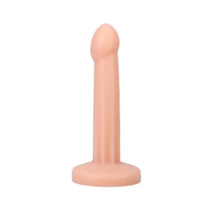 Smooth flesh-toned silicone dildo with a rounded tip and flat base, standing upright on a white background.