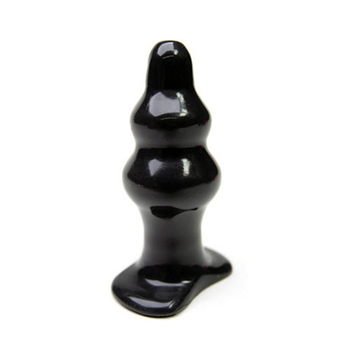 Black medium-sized tapered silicone plug with a smooth, contoured shape and flared base for secure use.