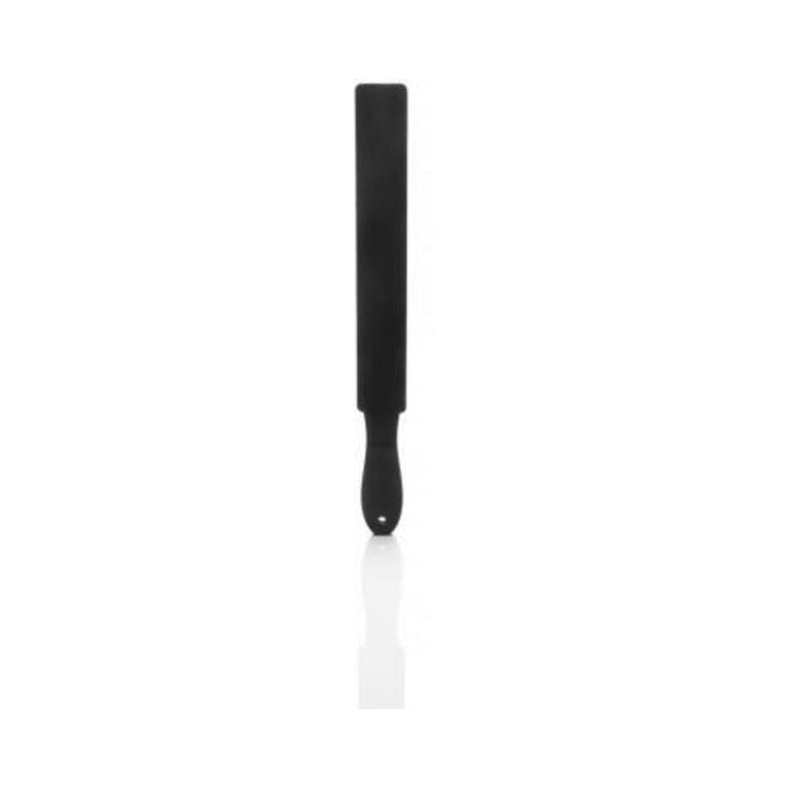 Black silicone paddle with a smooth handle and long, flexible strap for versatile use.