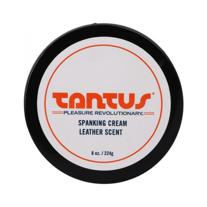 Top view of Tantus Apothecary Spanking Cream in leather scent, 8 oz container with black lid and white label.