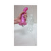 Hand holding a pink wave-textured silicone toy next to a clear plastic water bottle for size comparison.
