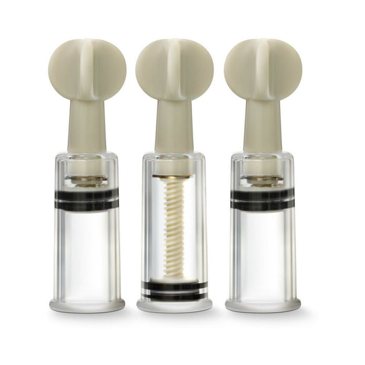 Set of three clear Temptasia clit and nipple twist suckers with beige twist handles and adjustable suction cylinders.