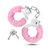 Pair of silver handcuffs with soft pink faux fur covers and two matching silver keys on a white background.