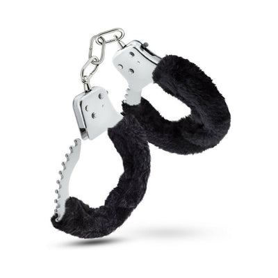Pair of metal handcuffs lined with soft black faux fur for comfortable restraint and adjustable fit.