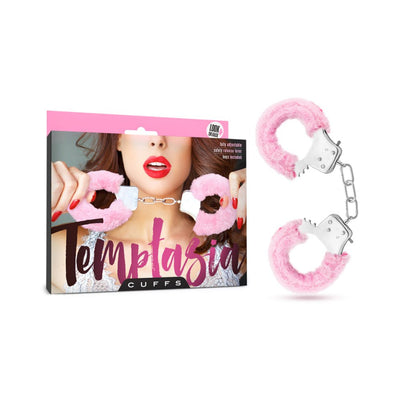 Pink faux fur-covered metal handcuffs with packaging featuring a woman holding the cuffs near her face.